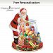 Thomas Kinkade Wishes Come True Personalized Snowglobe Featuring Fully Sculpted Santa Claus Figure & Sculpted Wood-Tone Base With Decorative Holly Leaves & Bows